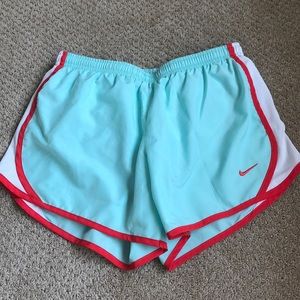 Mint/bright red Nike running shorts